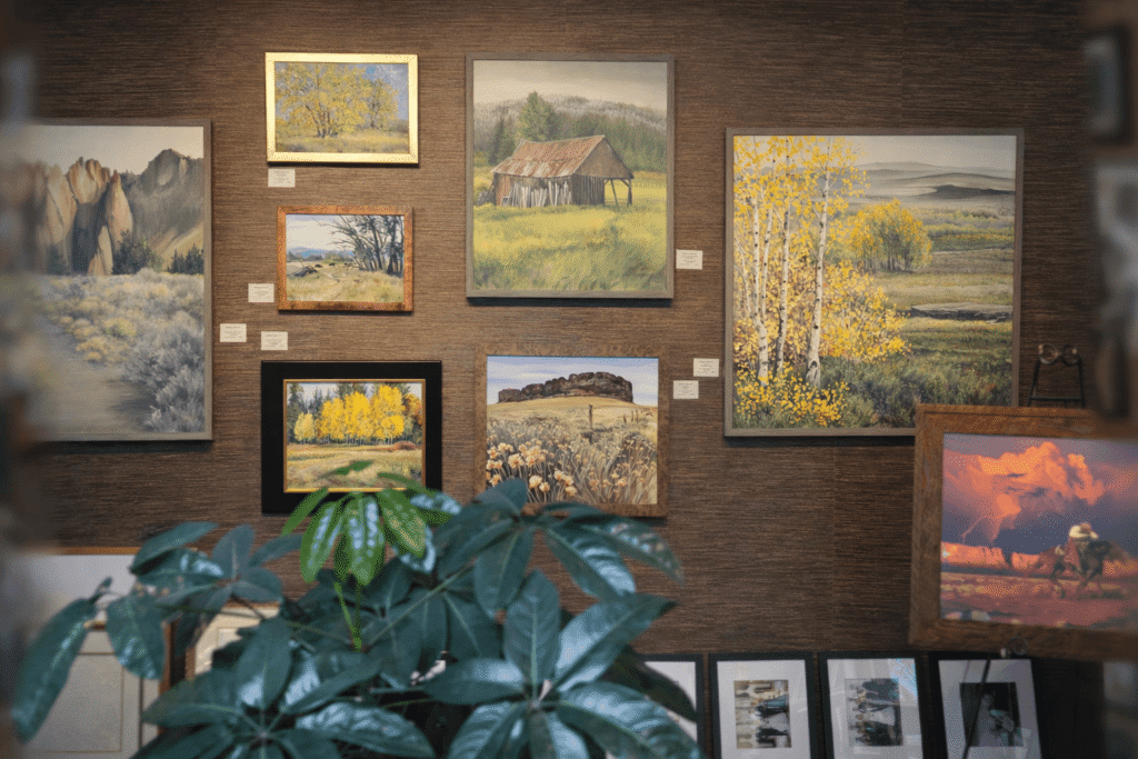 Gallery wall with landscape paintings